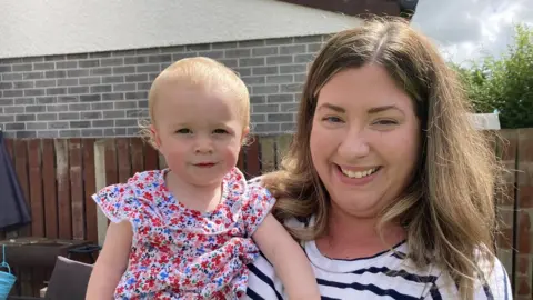 Ceri and daughter Anna in a garden