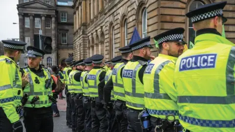 Getty Images Police at climate change protest in Glasgow