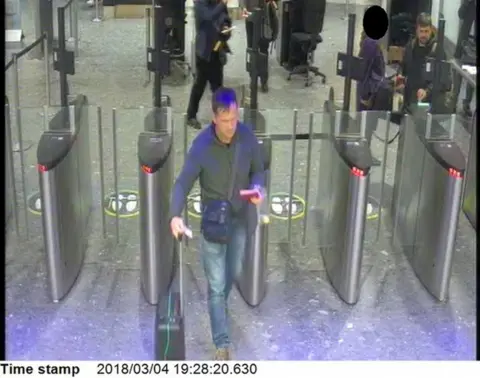 Metropolitan Police/PA Wire A screengrab from CCTV footage shows the two suspects passing through airport security