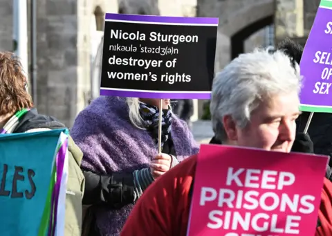 Getty Images Women's rights groups protest outside the Scottish Parliament over transgender prisoners they perceive as male, being housed in women's prisons, February 2023