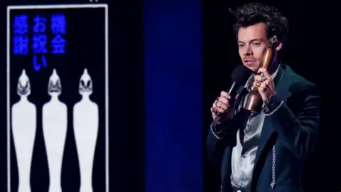 PA Media Harry Styles collects the Song of the Year award during the Brit Awards 2023 at the O2 Arena, London