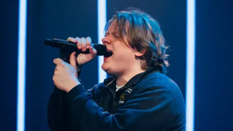 Lewis Capaldi performing on stage