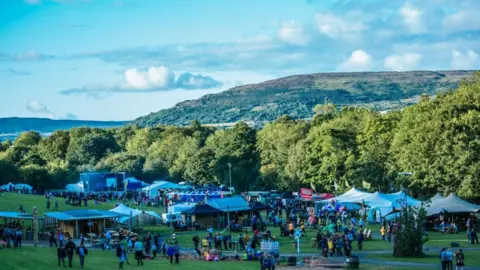 Ciara McMullan Festival surrounded by trees and hills