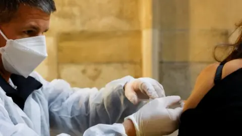 Reuters Vaccine administered in St Stephen's Cathedral in Vienna - 5 February