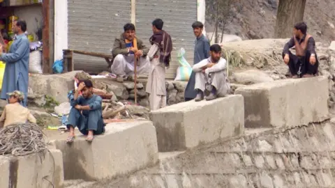 BBC Residents in the Manoor valley, Khyber Pakhtunkhwa, are stranded on the other side of the river's bank