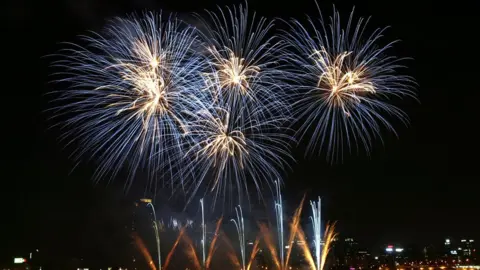 Getty Images Fireworks illuminate the sky over downtown Seoul