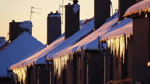 Getty Images Snow on rooftops