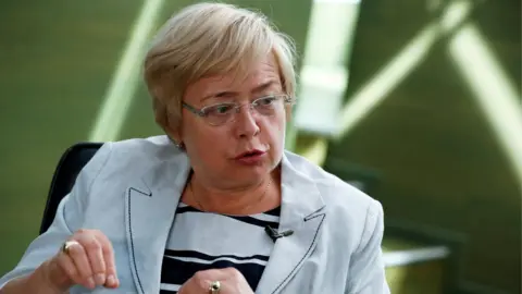 Reuters Supreme Court President Malgorzata Gersdorf speaks, seated in a chair