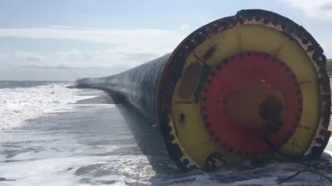 BBC A giant pipe on the shoreline