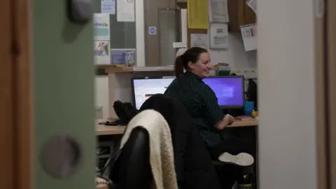 Kay Dartford at her desk in Bristol.