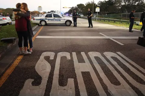 Getty Images Police seal off the Marjory Stoneman Douglas High School