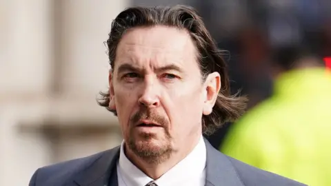 PA Media Richard Hall outside the High Court, central London