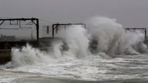 Reuters Waves alongside railway tracks