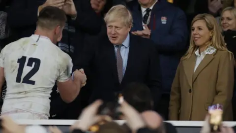 Getty Images Boris Johnson shaking hands with Owen Farrell