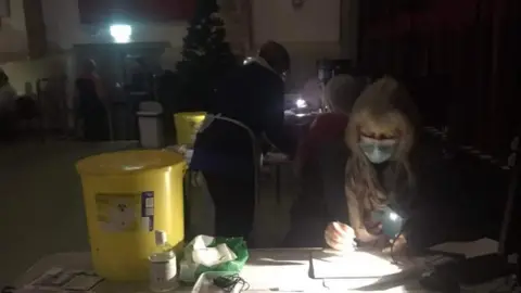 Millfield Surgery/Lorraine Boyd Jab volunteers working by torch light