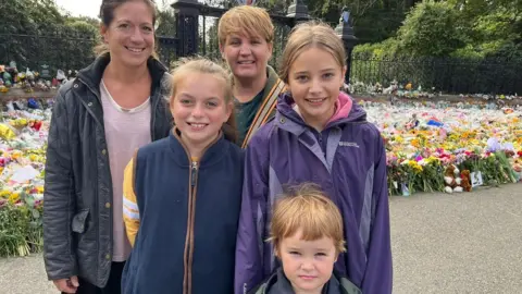 Kate Scotter/BBC Emily Campbell and Lisa Sly with Betsy, 11, Theo, 4, and Freya, 12