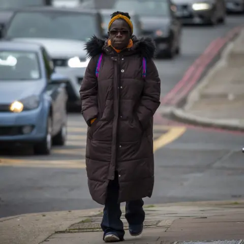 Phil Coomes Rosamund Adoo-Kissi-Debrah walking along the South Circular