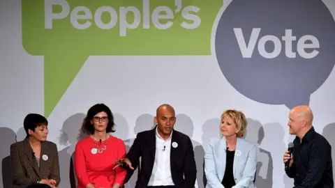 Getty Images Chuka Umunna with members of the People's Vote campaign