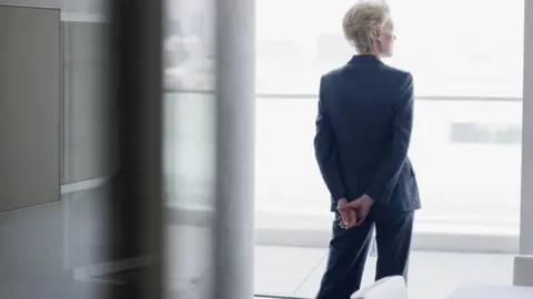 Woman standing at window