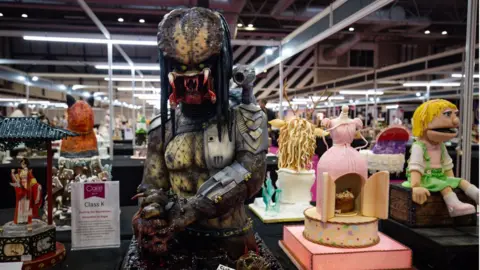 PA Media Cakes, including a "Predator" entry, competing in the Pushing the Boundaries category at Cake International 2019 at the NEC, Birmingham.