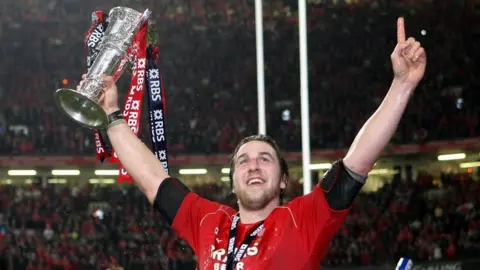 PA Media Ryan Jones with the 6 Nations trophy after during the RBS 6 Nations match at the Millennium Stadium, Cardiff. Picture date: Saturday March 15, 2008.