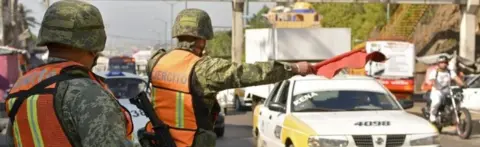 AFP Soldiers from the Mexican Army stop drivers at a checkpoint on the Acapulco-Mexico City highway on December 5, 2017 in Acapulco, Guerrero state, Mexico.