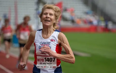 Alex Rotas Angela Copson, 70, runs to a new world record in the women's 10,000m race. Her time of 44.25mins was a whole 3 minutes faster than the existing European record for this distance in her age group (70-74 year old) and 18 seconds faster than the existing world record.