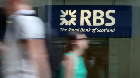 Getty Images RBS branch with blurred figures in front