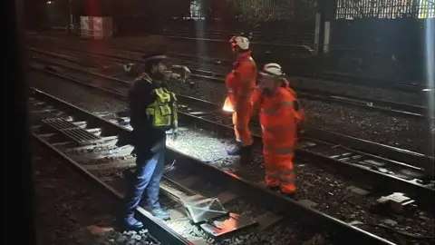 Emma Bentley Workers on rail track between Paddington and Acton Main line