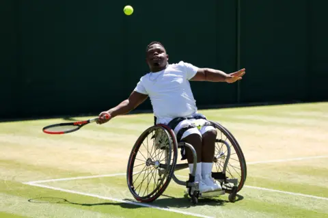 Getty Images South Africa's Donald Ramphadi playing at Wimbledon in the quad wheelchair men's doubles semi-final, London, the UK - Friday 8 July 2022