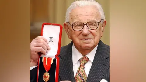 PA Media Sir Nicholas Winton with his Knighthood at Buckingham Palace