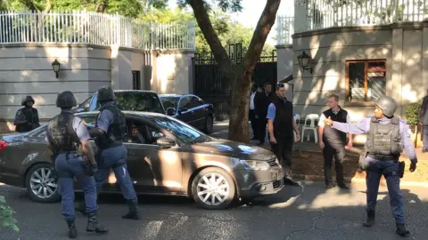 EPA The Hawks special police unit raid the Gupta family compound on 14 February 2018