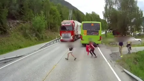A child crossing a road.