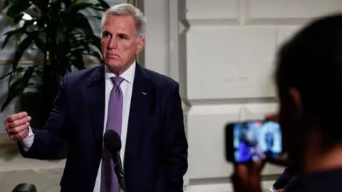 Getty Images US House Speaker Kevin McCarthy speaks with reporters on Tuesday