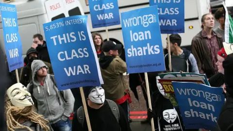 Getty Images Occupy London highlighted Wonga's sky-high interest rates at a protest on May Day in 2014