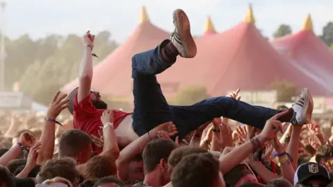 Getty Images A person crowdsurfing at Reading festgival