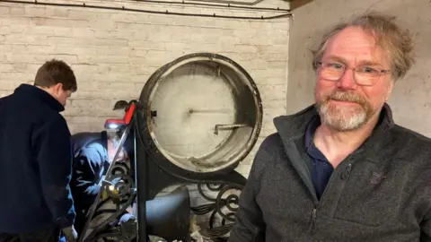 Andrew Turner/BBC Clock restorer, Simon Michlmayr