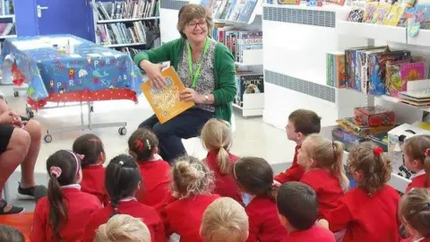 Family Library Children and staff in the Family Library