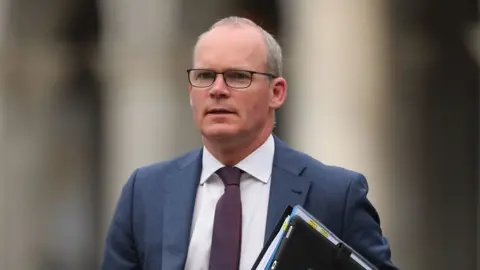 PA Media Simon Coveney