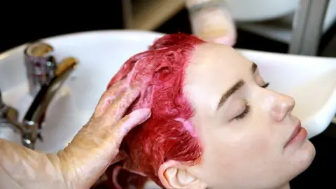 Model having hair washed