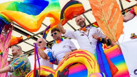 Getty Images Members of the Gay Men's Chorus on a float during this month's Brighton Pride Parade