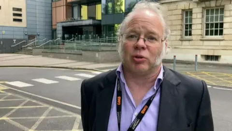 BBC Union secretary Andy Newman stood outside the county hall council building