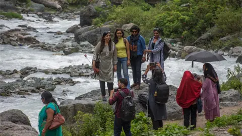 Getty Images A group of Indian tourists take their pictures on September 4, 2022 in Chandanwari 112 Km ( 69 miles) south Srinagar,