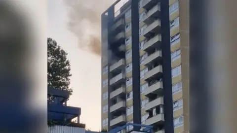 X user: @shaunyb Flat on fire behind Kilburn Market