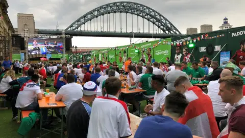 PA Media Fans at the fan park ahead of the game