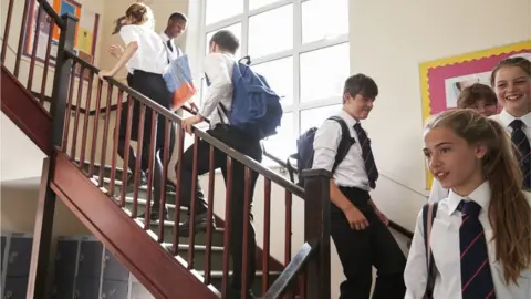 Getty Images School pupils walking up stairs