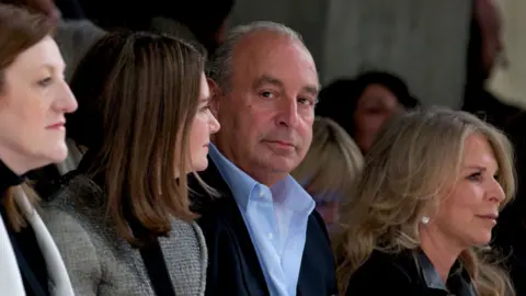 AFP/Getty Philip Green with wife Tina, right, at London Fashion Week in 2013