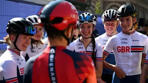 Getty Images British rider Tom Pidcock chats with a group of GB under-16 riders