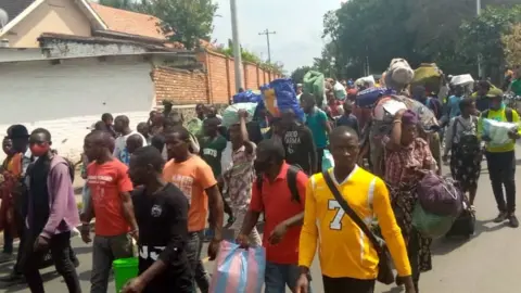 BBC Residents of Goma evacuate the city