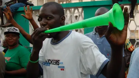 AFP People celebrate the victory of Julius Maada Bio as new president of Sierra Leone on April 4, 2018 in Freetown, Sierra Leone.